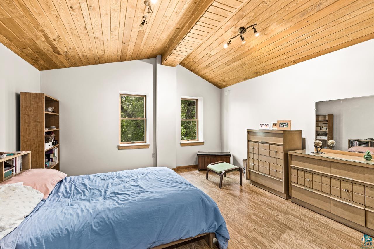 4800 Tower Road Moose Lake, MN 55767 - Photo 60 of 83 Vaulted wood-finish plank ceiling with exposed beams