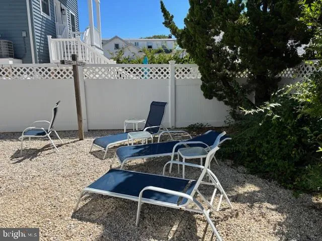 a view of a livingroom with furniture and windows