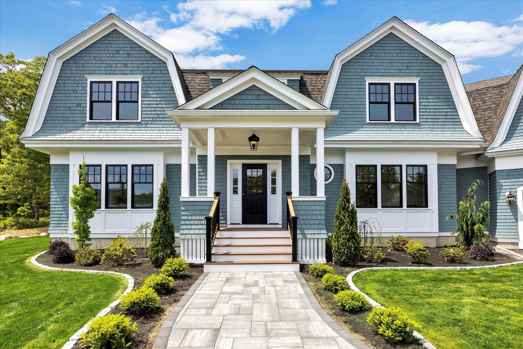 61 McKenna Ridge Drive East Falmouth, MA 02536 - Photo 1 of 44 a front view of a house with a yard