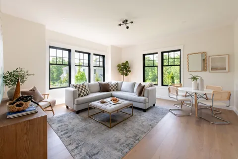 an empty room with a empty space and windows