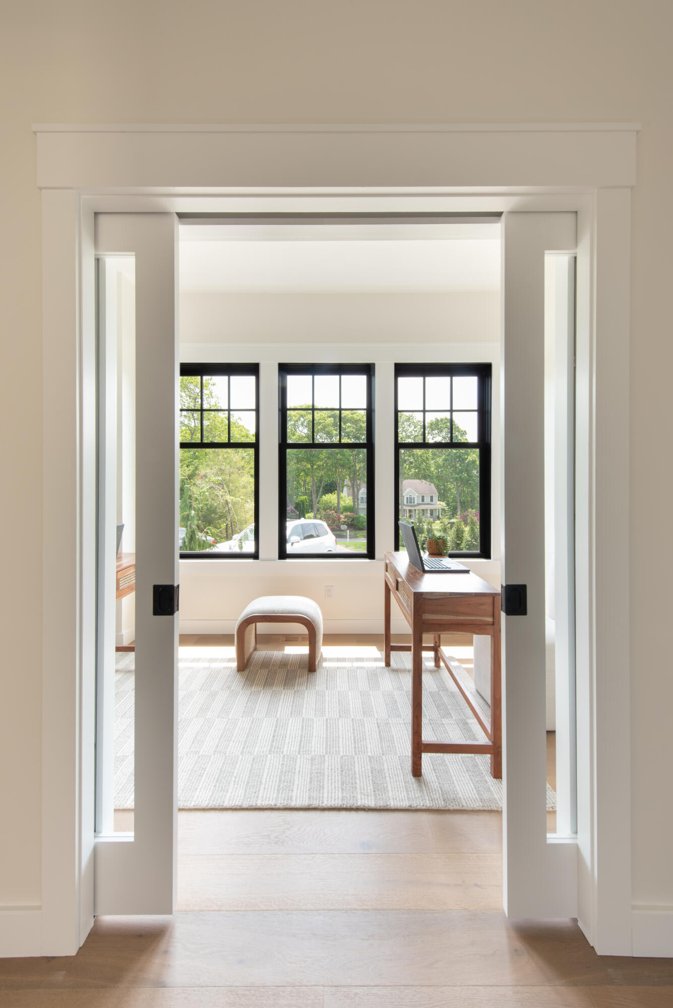 61 McKenna Ridge Drive East Falmouth, MA 02536 - Photo 20 of 44 a living room with a floor to ceiling window and a table