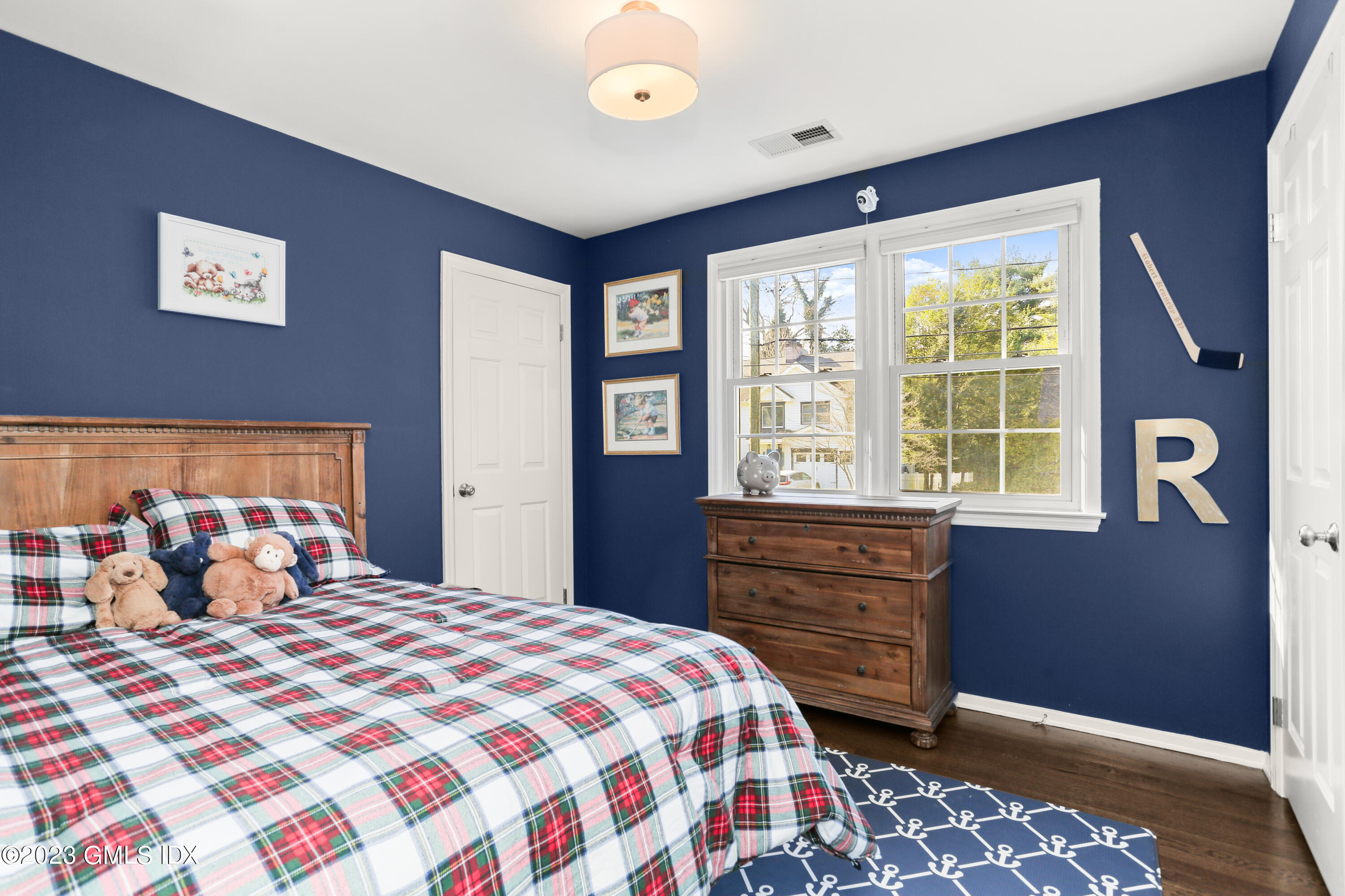 25 Manor Road Old Greenwich, CT 06870 - Photo 15 of 21 a bedroom with a bed and a window