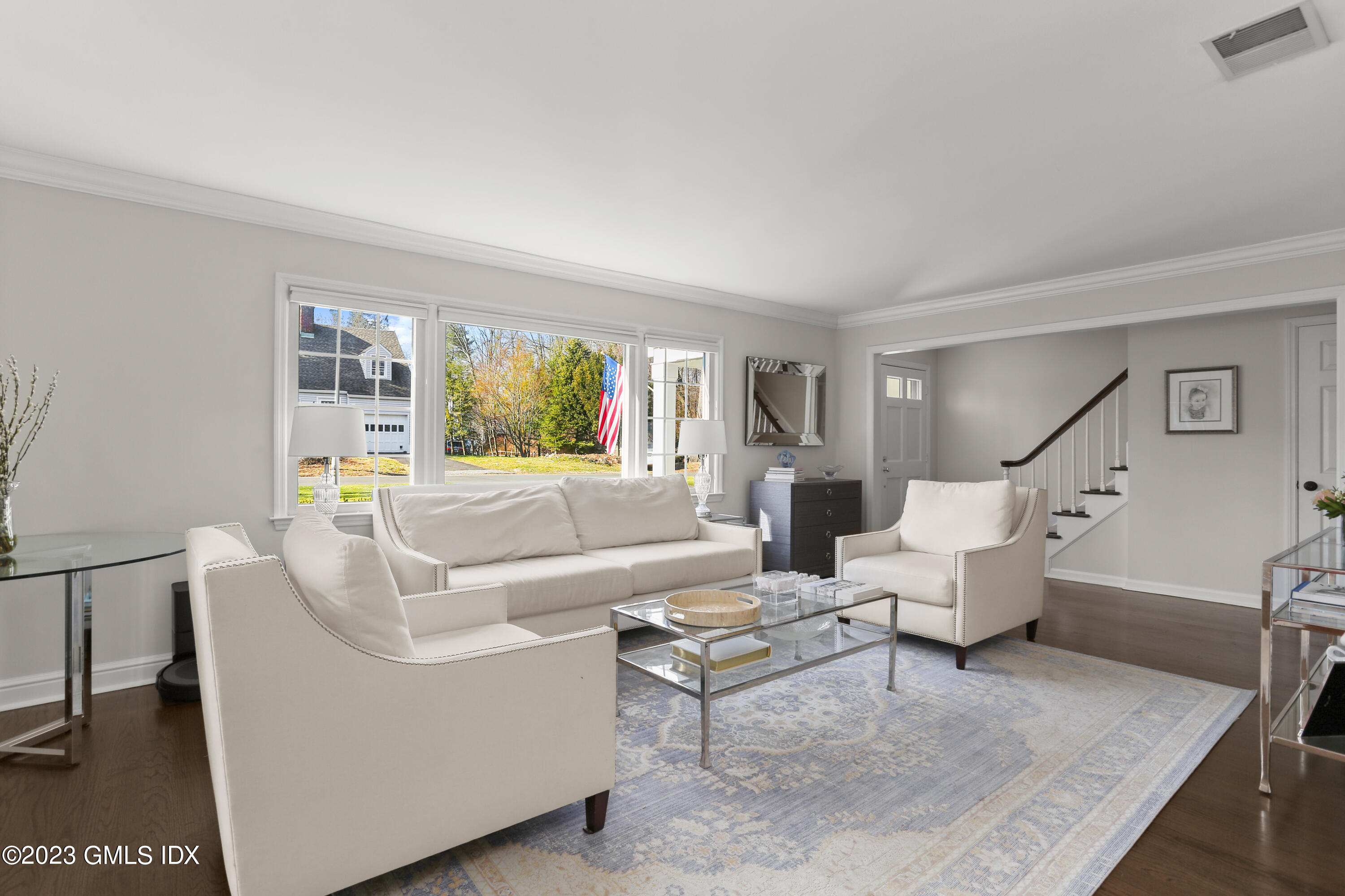 25 Manor Road Old Greenwich, CT 06870 - Photo 2 of 21 a living room with furniture and a large window