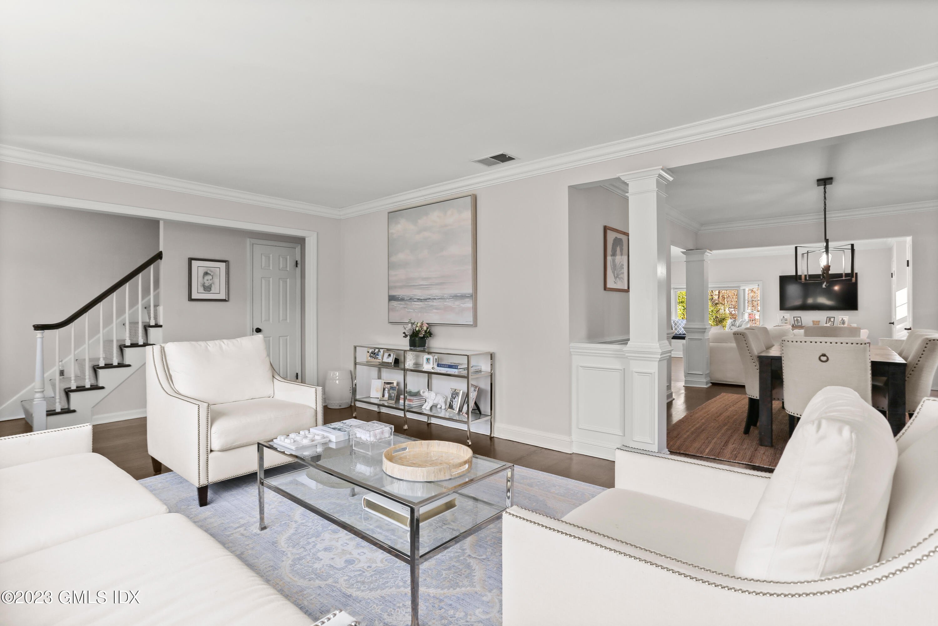 25 Manor Road Old Greenwich, CT 06870 - Photo 3 of 21 a living room with furniture a fireplace and a flat screen tv