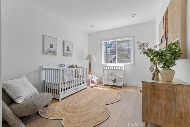 a bedroom with furniture and a window