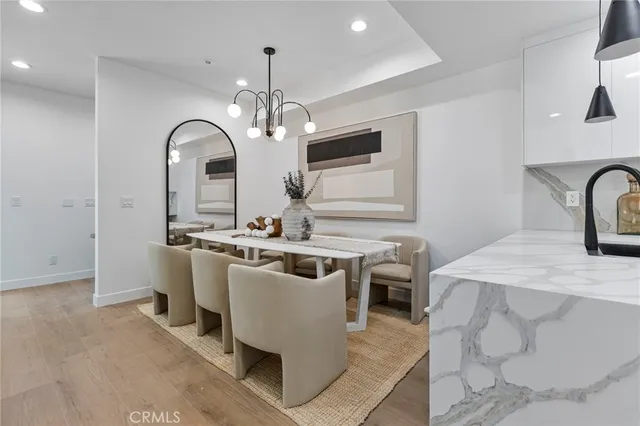 a view of a kitchen area with furniture and chandelier