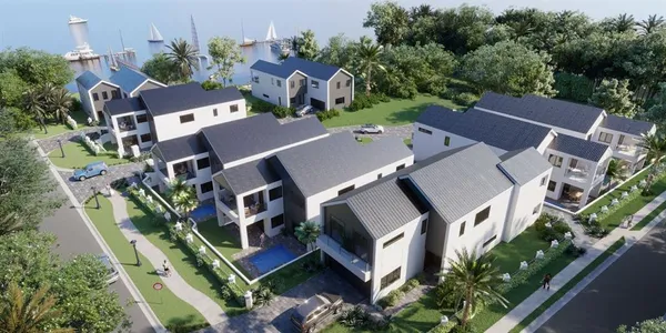 an aerial view of residential houses with outdoor space