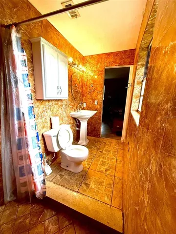 a bathroom with a bathtub and shower