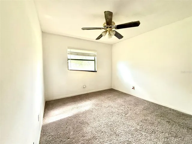 a bathroom with a double vanity sink toilet and a mirror