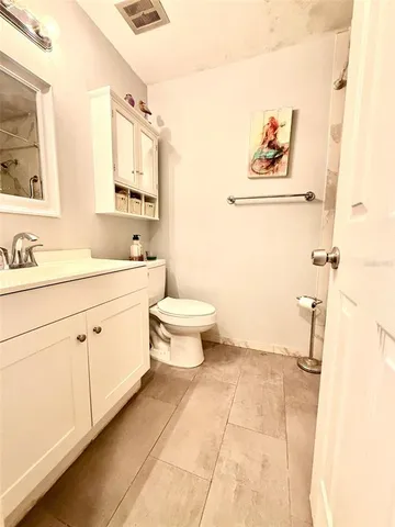 a view of a balcony with wooden floor and door