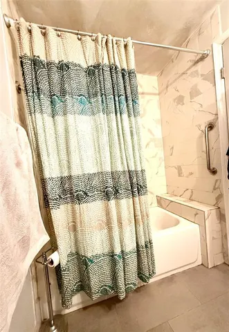 a bathroom with a toilet sink vanity and mirror