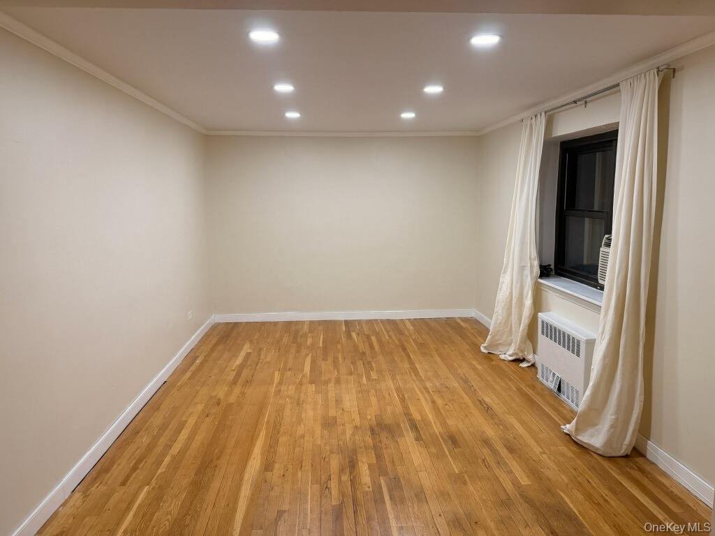 67-th Rd 10245th Queens, NY 11375 - Photo 3 of 6 a view of a room with wooden floor and fence