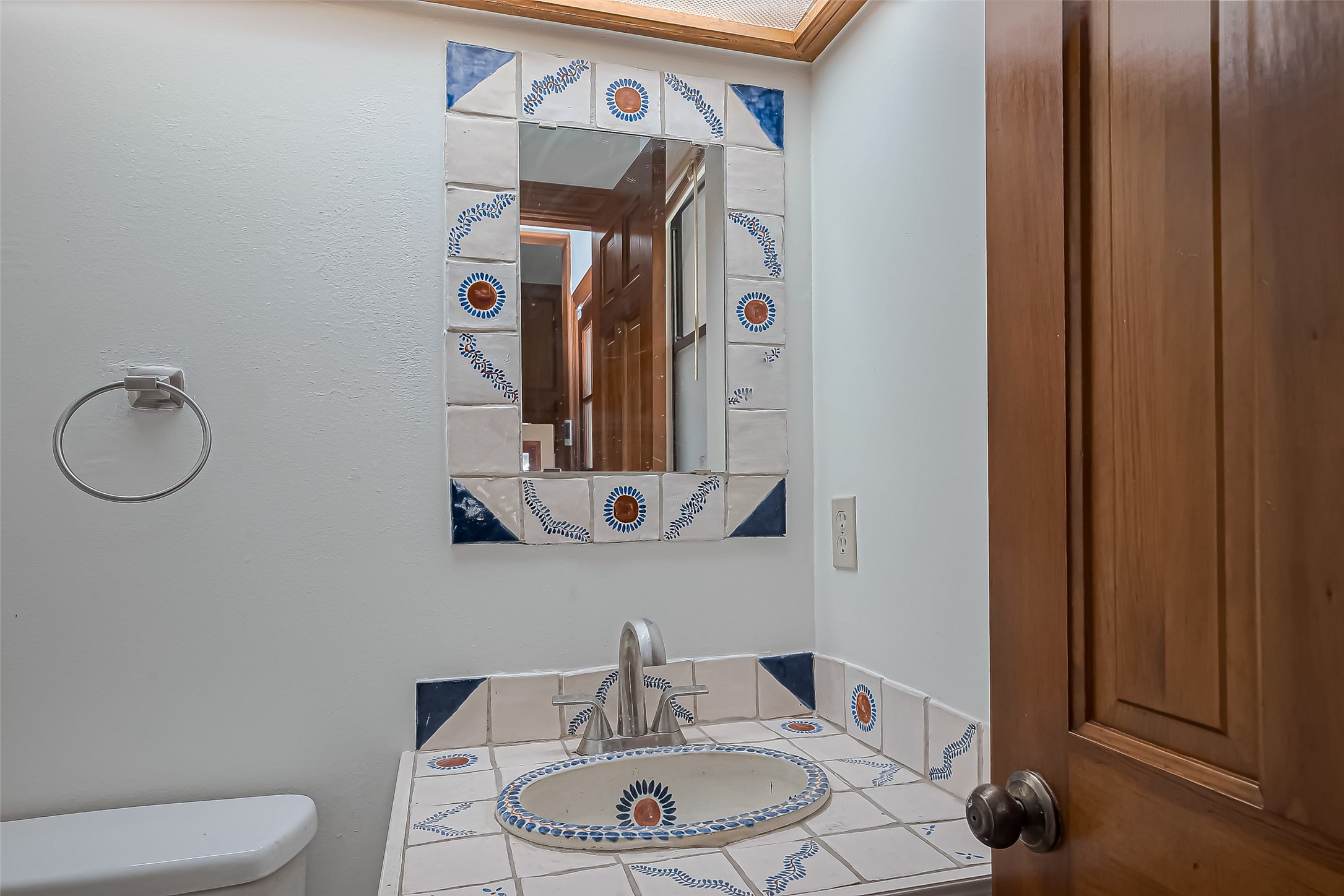 18307 Champion Forest Drive Spring, TX 77379 - Photo 15 of 49 a bathroom with a toilet a sink and mirror