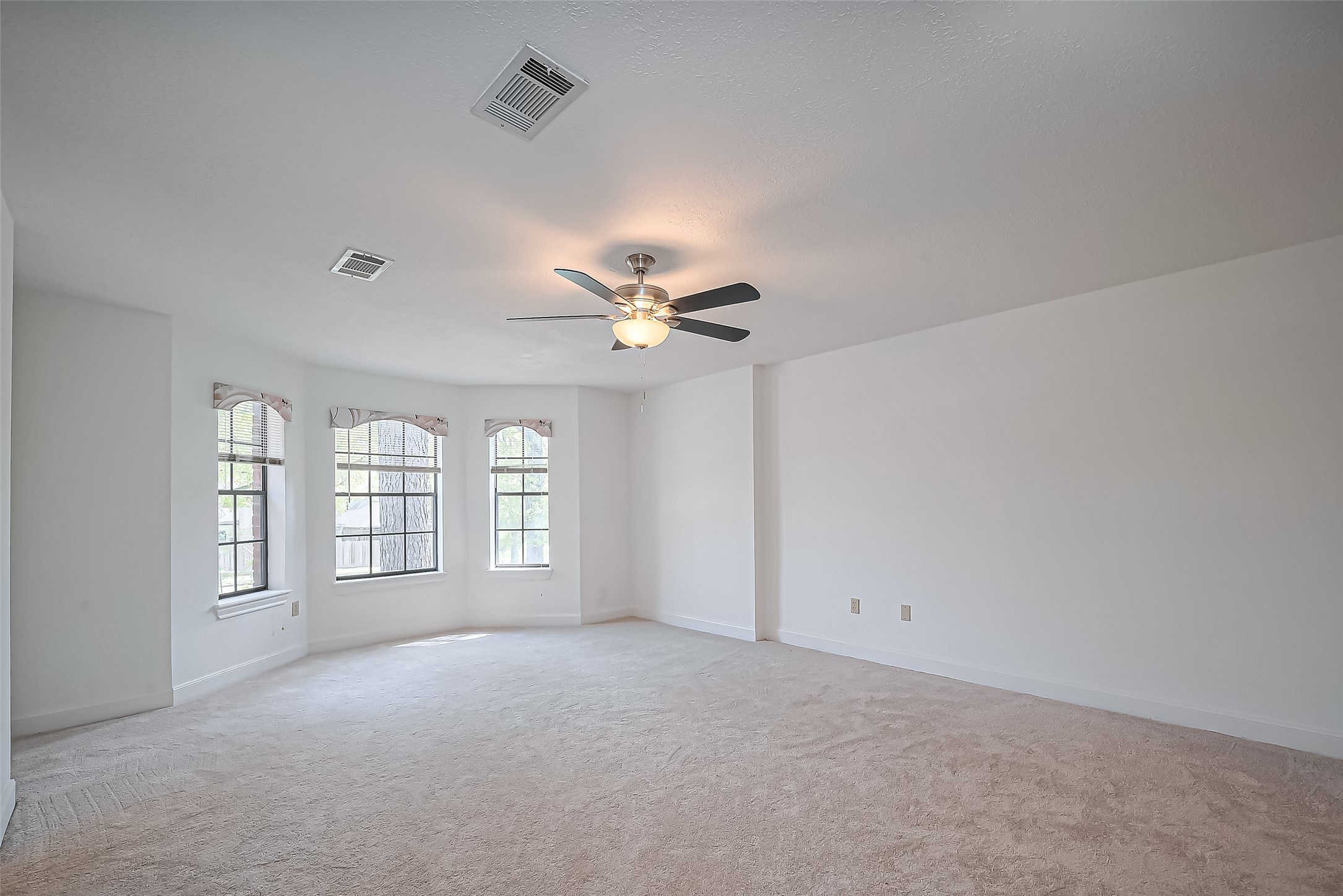 18307 Champion Forest Drive Spring, TX 77379 - Photo 18 of 49 a view of an empty room with a window
