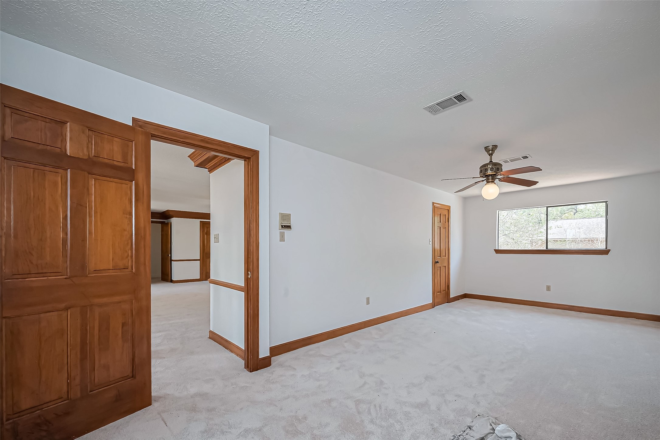 18307 Champion Forest Drive Spring, TX 77379 - Photo 34 of 49 an empty room with windows and closet