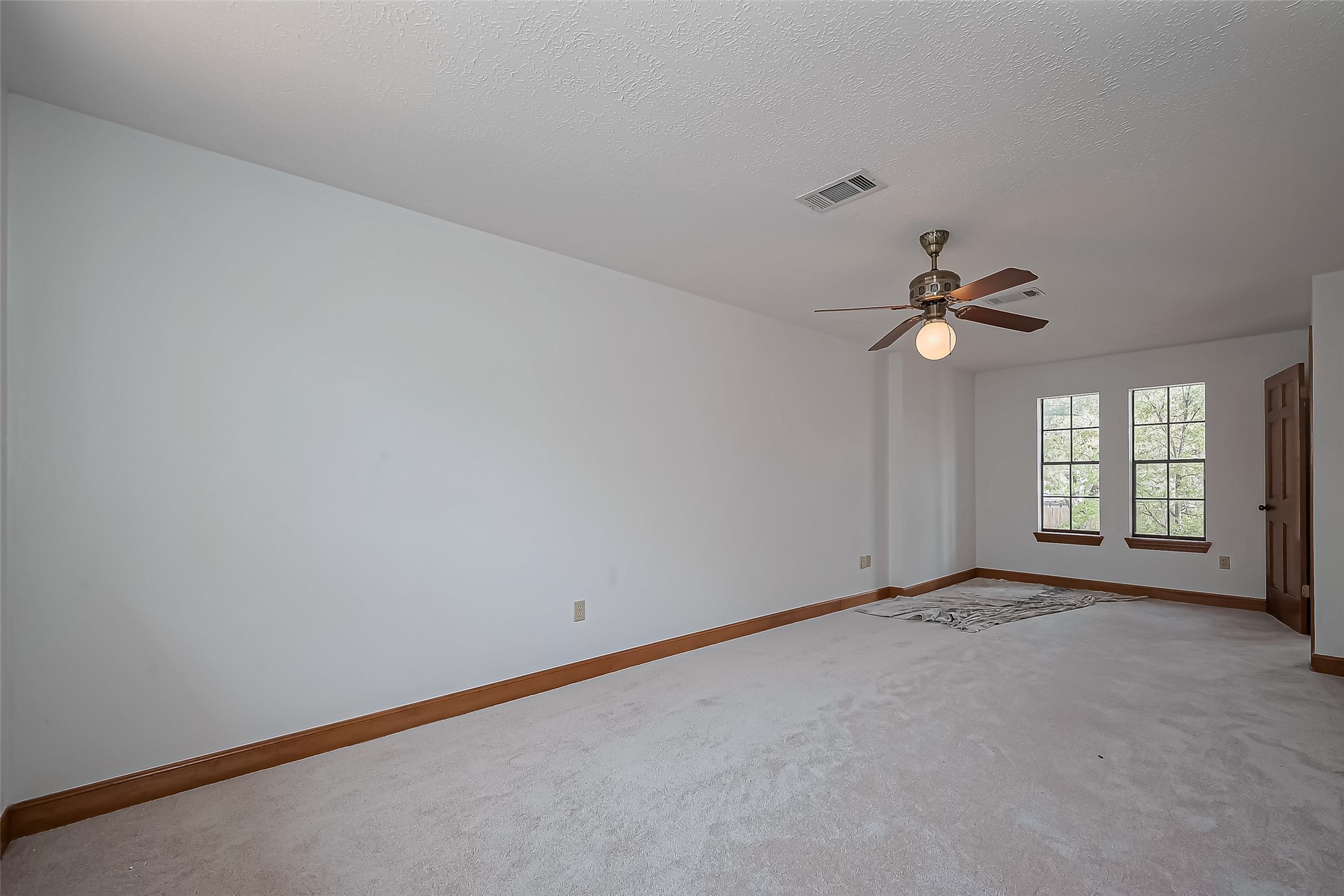 18307 Champion Forest Drive Spring, TX 77379 - Photo 36 of 49 a view of an empty room with a window