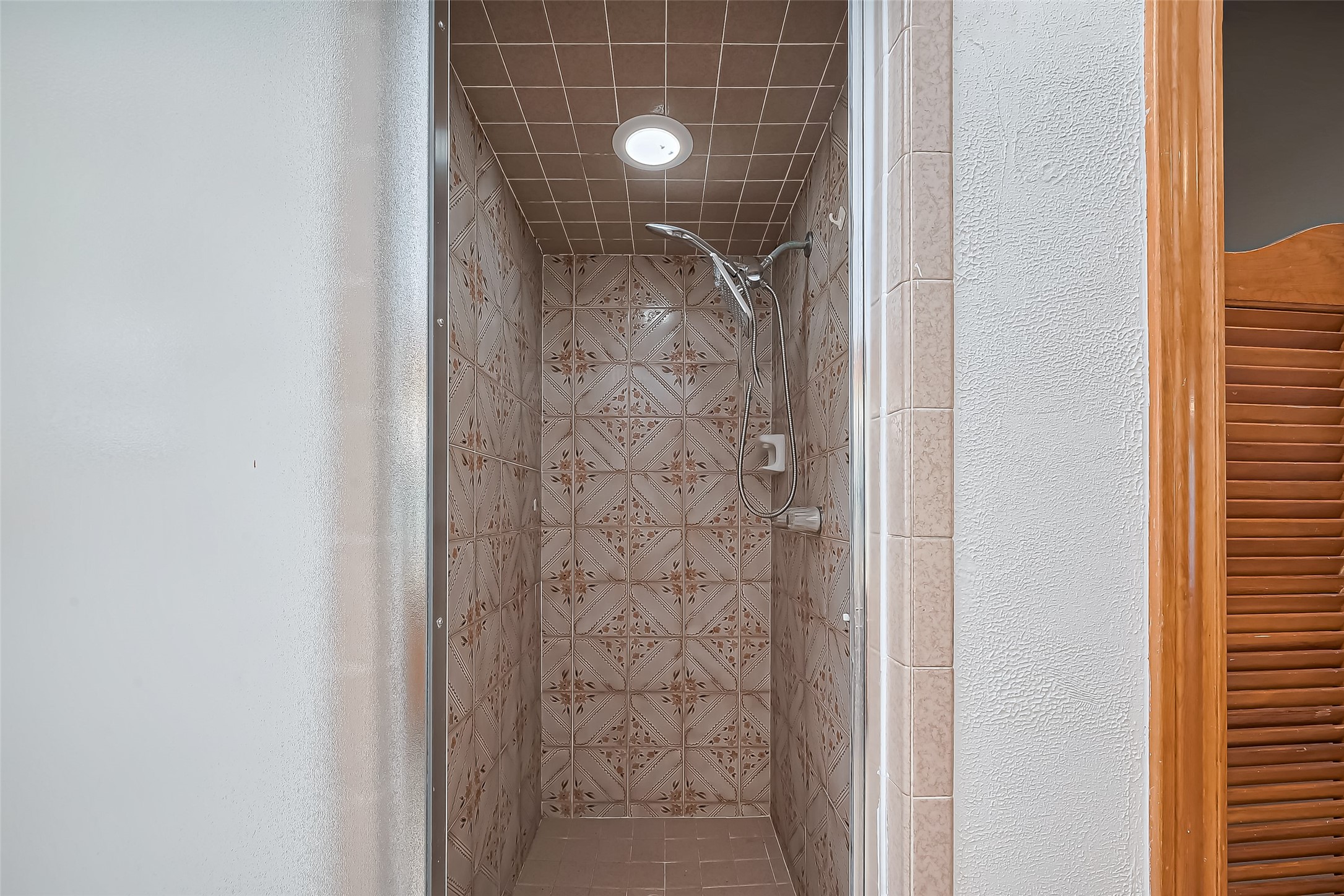 18307 Champion Forest Drive Spring, TX 77379 - Photo 42 of 49 a bathroom with a shower