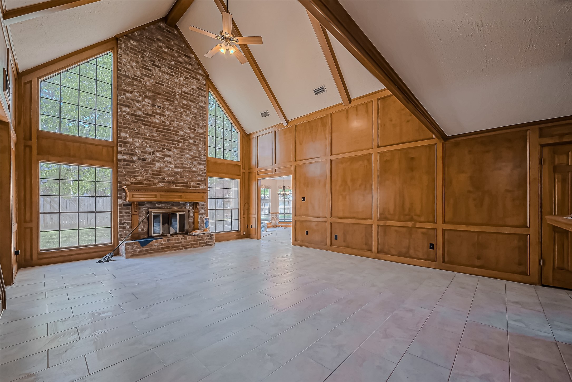 18307 Champion Forest Drive Spring, TX 77379 - Photo 6 of 49 a view of a livingroom with dishwasher and fireplace