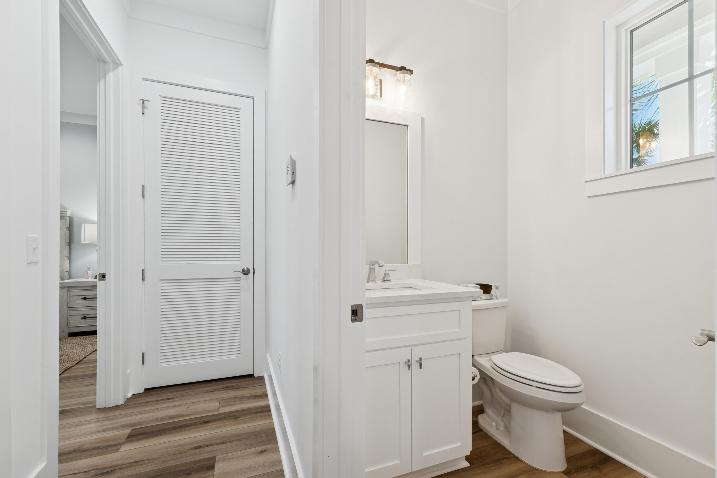 342 Beach Bike Way Inlet Beach Inlet Beach, FL 32461 - Photo 23 of 77 a bathroom with a toilet a sink and wooden floor