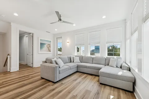 a view of a livingroom with furniture and natural light