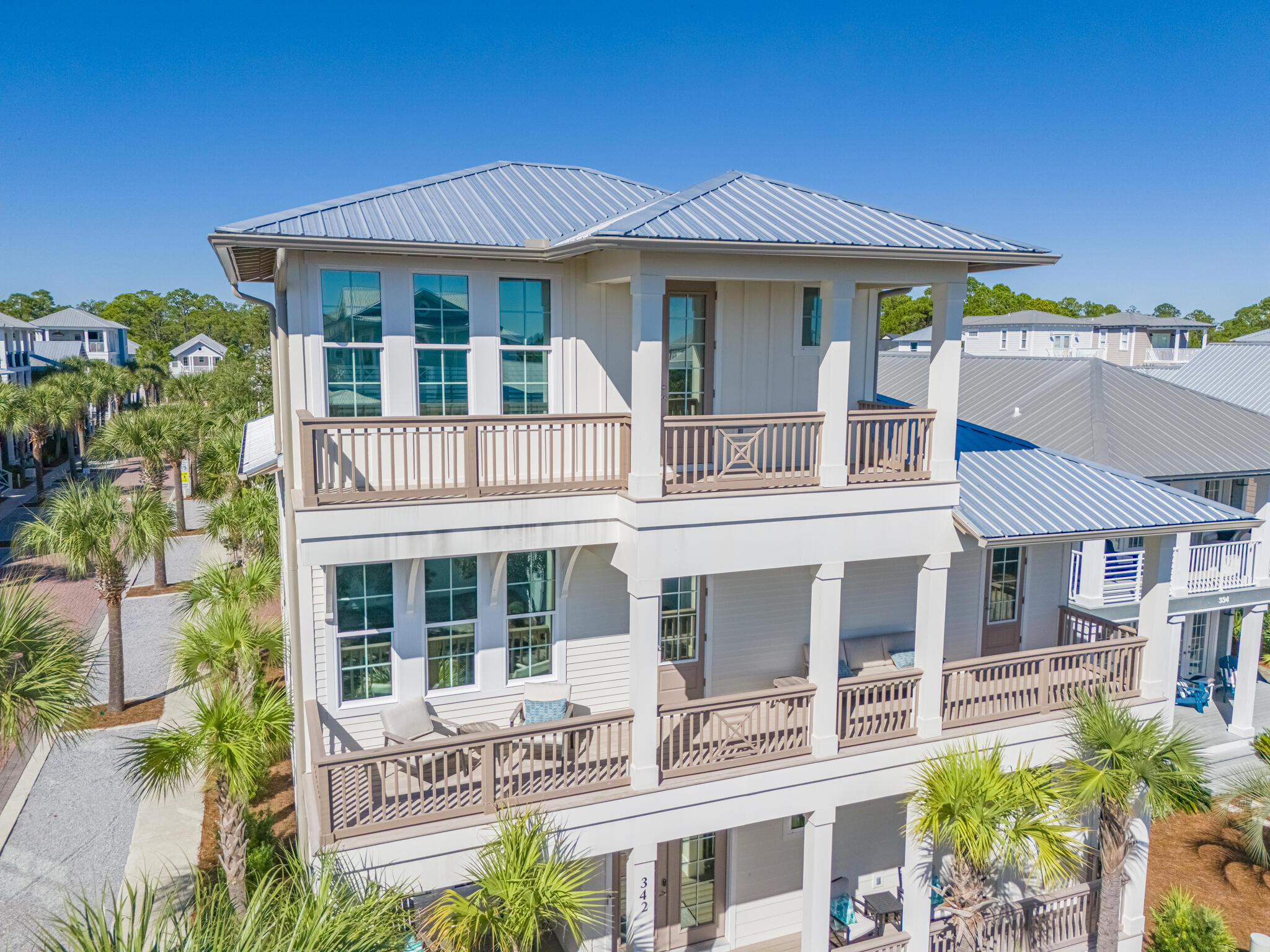 342 Beach Bike Way Inlet Beach Inlet Beach, FL 32461 - Photo 39 of 77 a front view of a residential apartment building with a yard