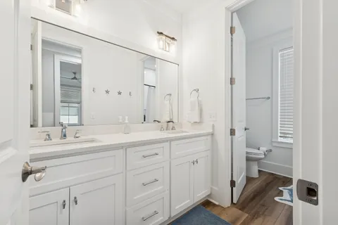 a view of balcony with wooden floor and outdoor seating