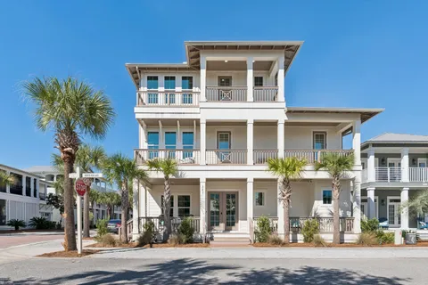 a kitchen with granite countertop a sink and cabinets with wooden floor