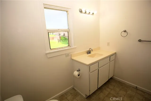 a bathroom with a sink and mirror
