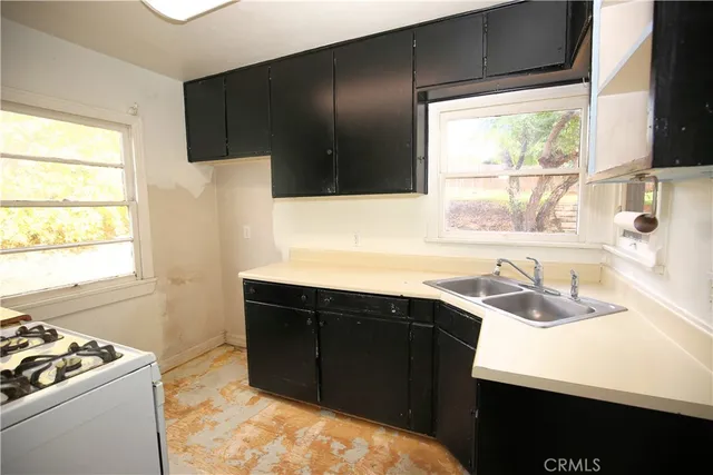 a kitchen with a sink and a window