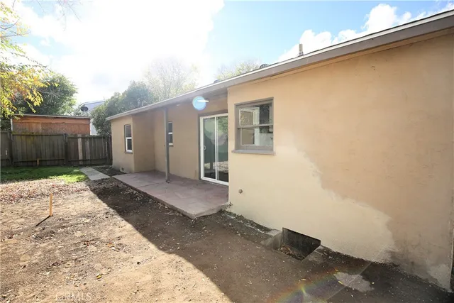 a room with wooden door and glass door