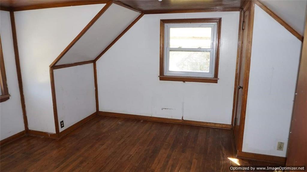 322 Beulah Road Pittsburgh, PA 15235 - Photo 14 of 22 an empty room with wooden floor and windows