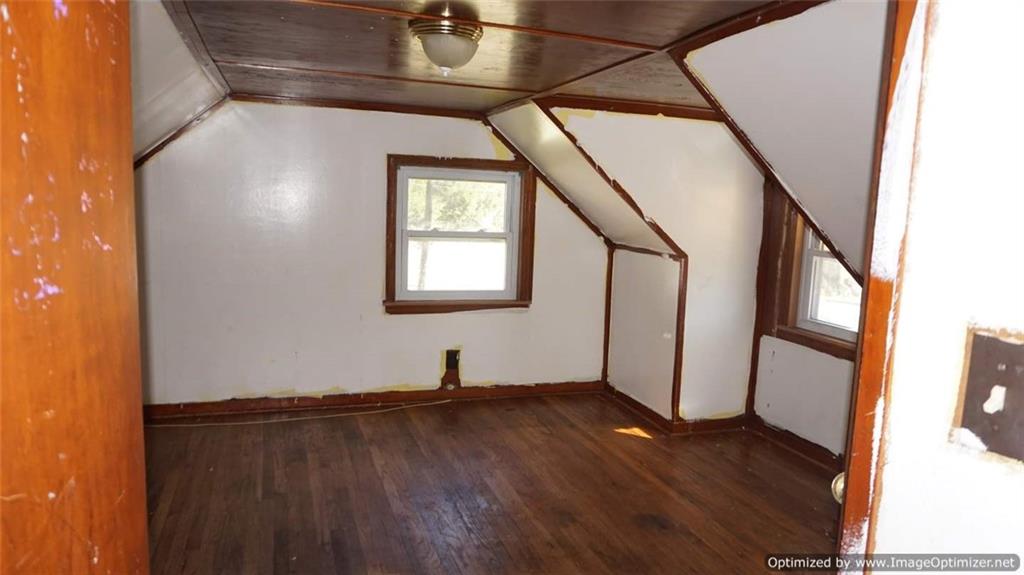 322 Beulah Road Pittsburgh, PA 15235 - Photo 15 of 22 a view of a hallway with wooden floor and staircase