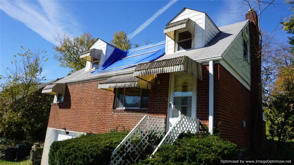 322 Beulah Road Pittsburgh, PA 15235 - Photo 22 of 22 a house with a tree in front of it