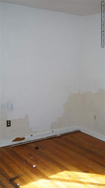 322 Beulah Road Pittsburgh, PA 15235 - Photo 7 of 22 a view of a room with an empty space and wooden floor