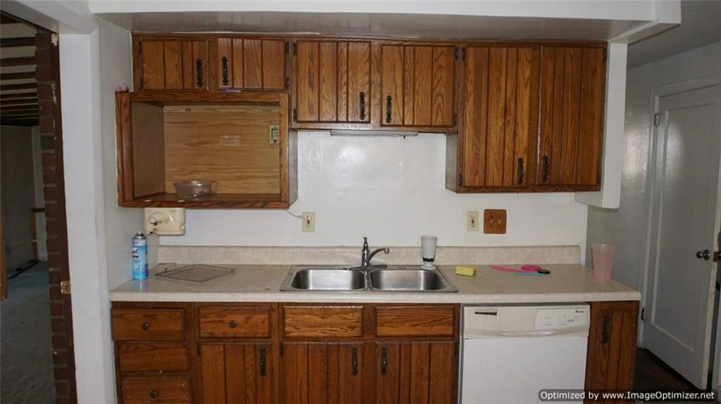 322 Beulah Road Pittsburgh, PA 15235 - Photo 8 of 22 a kitchen with granite countertop a sink cabinets and stainless steel appliances