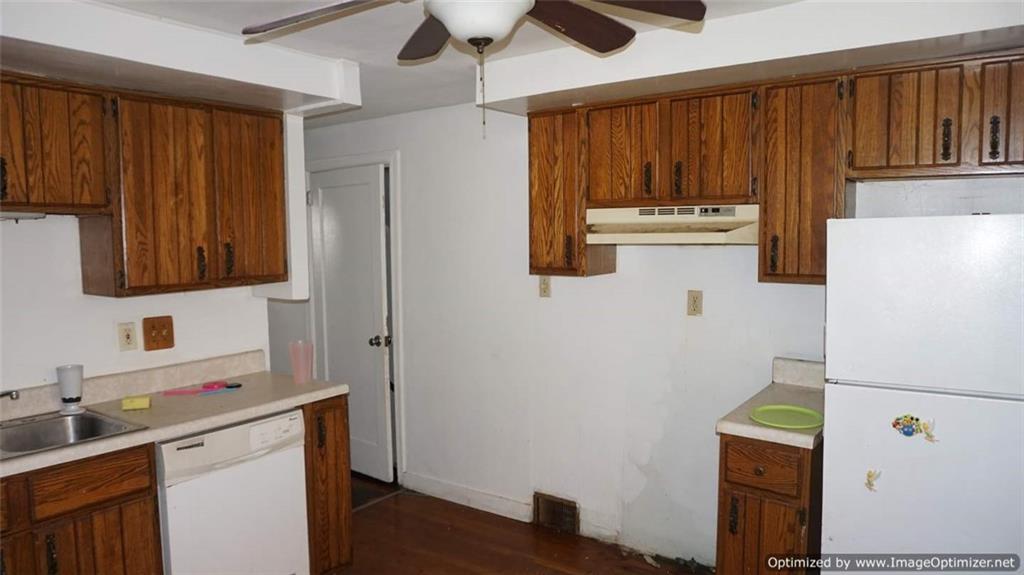 322 Beulah Road Pittsburgh, PA 15235 - Photo 9 of 22 a white refrigerator freezer sitting inside of a kitchen