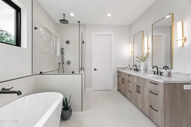 a bathroom with a bathtub and shower