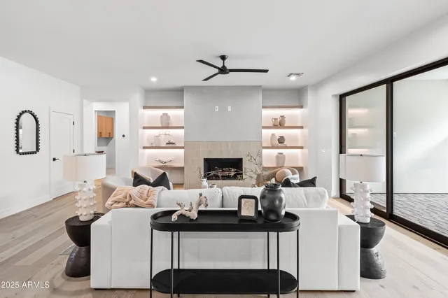 a living room with furniture and a large window