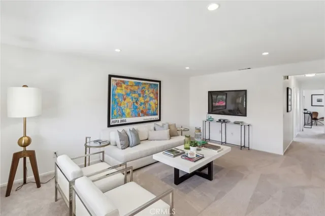 a living room with furniture and a table