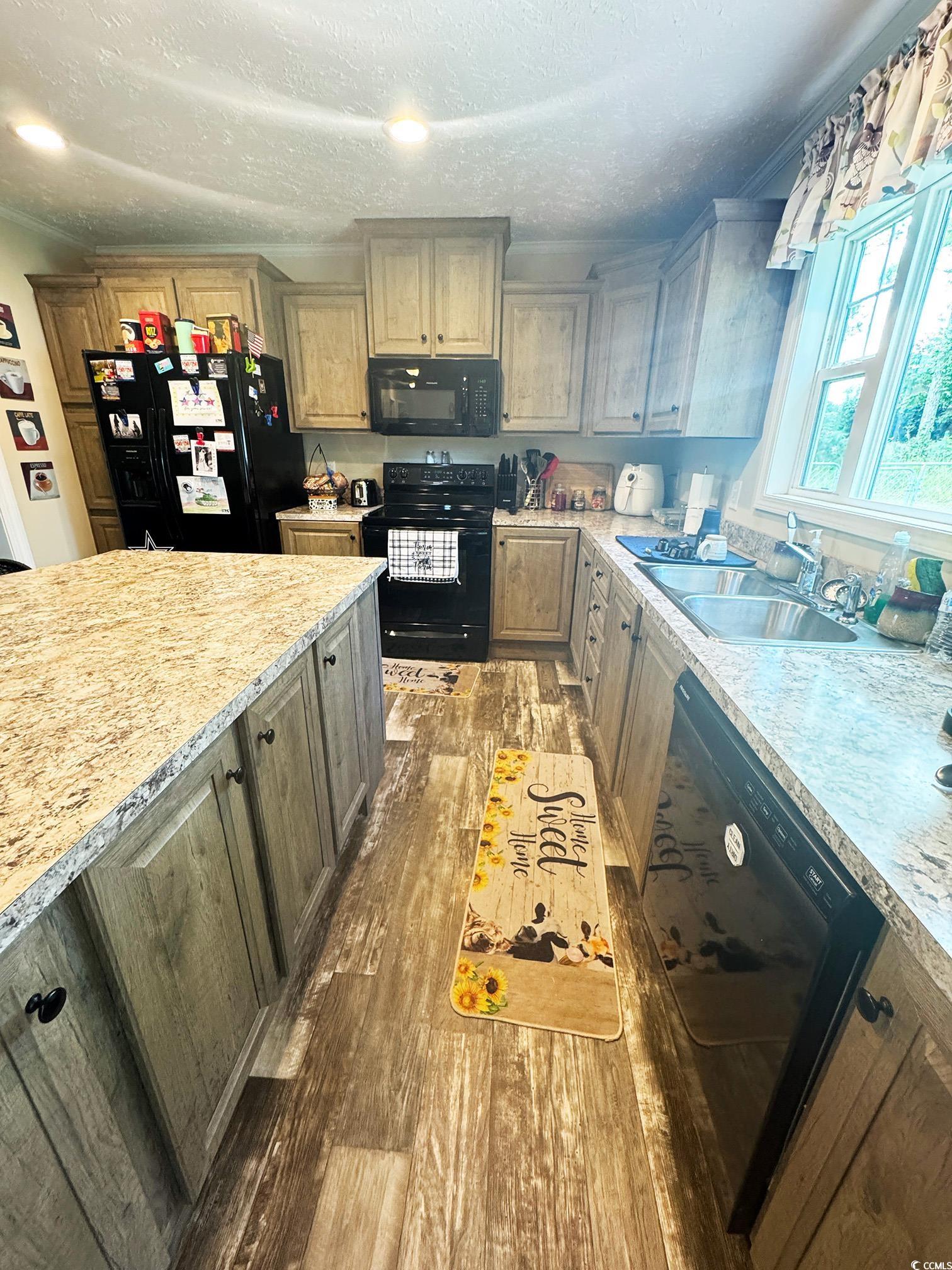 2620 Red Bluff Road Loris, SC 29569 - Photo 14 of 33 Kitchen with light countertops, black appliances,