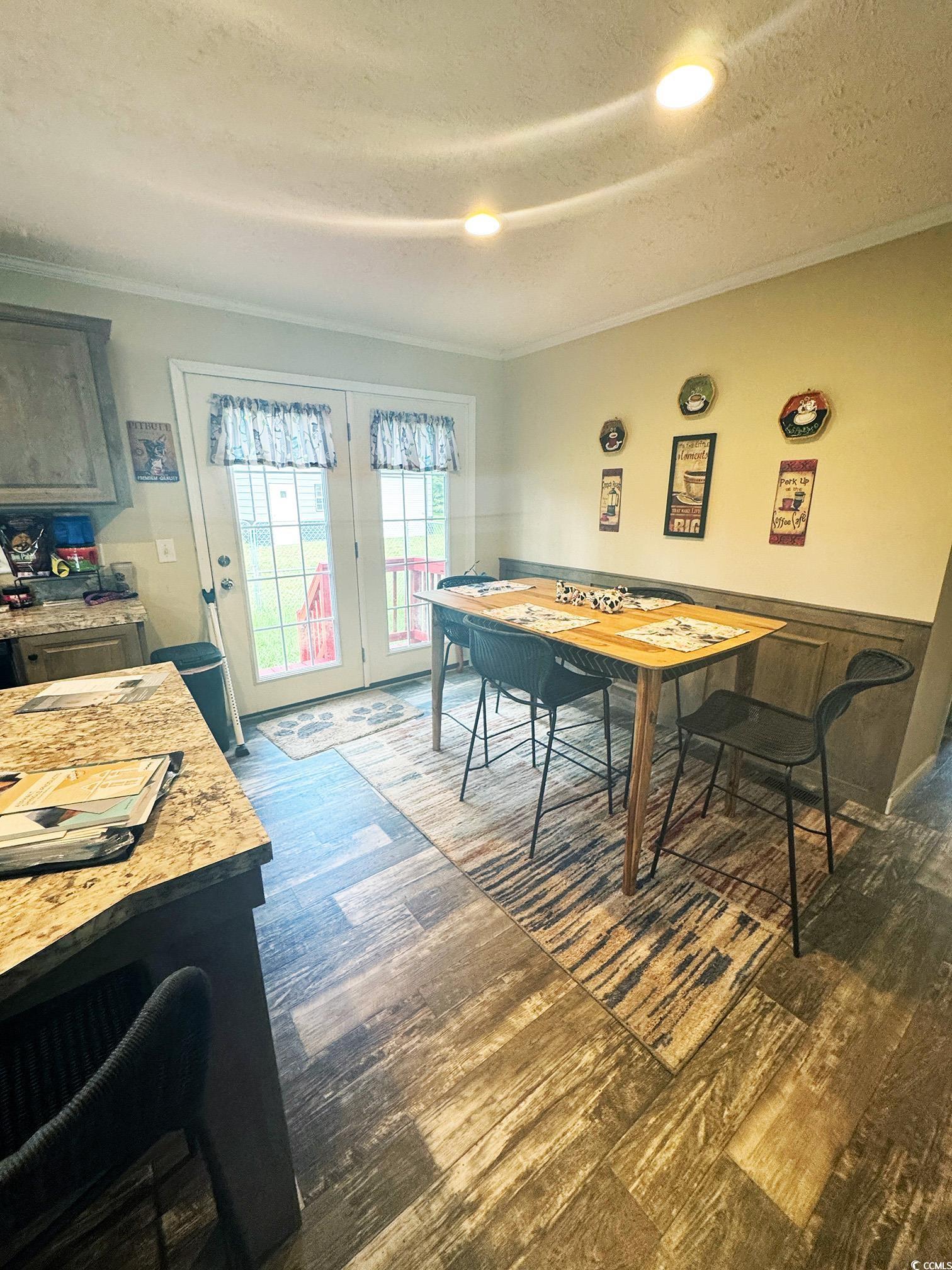 2620 Red Bluff Road Loris, SC 29569 - Photo 16 of 33 Dining space featuring ornamental molding, dark wo