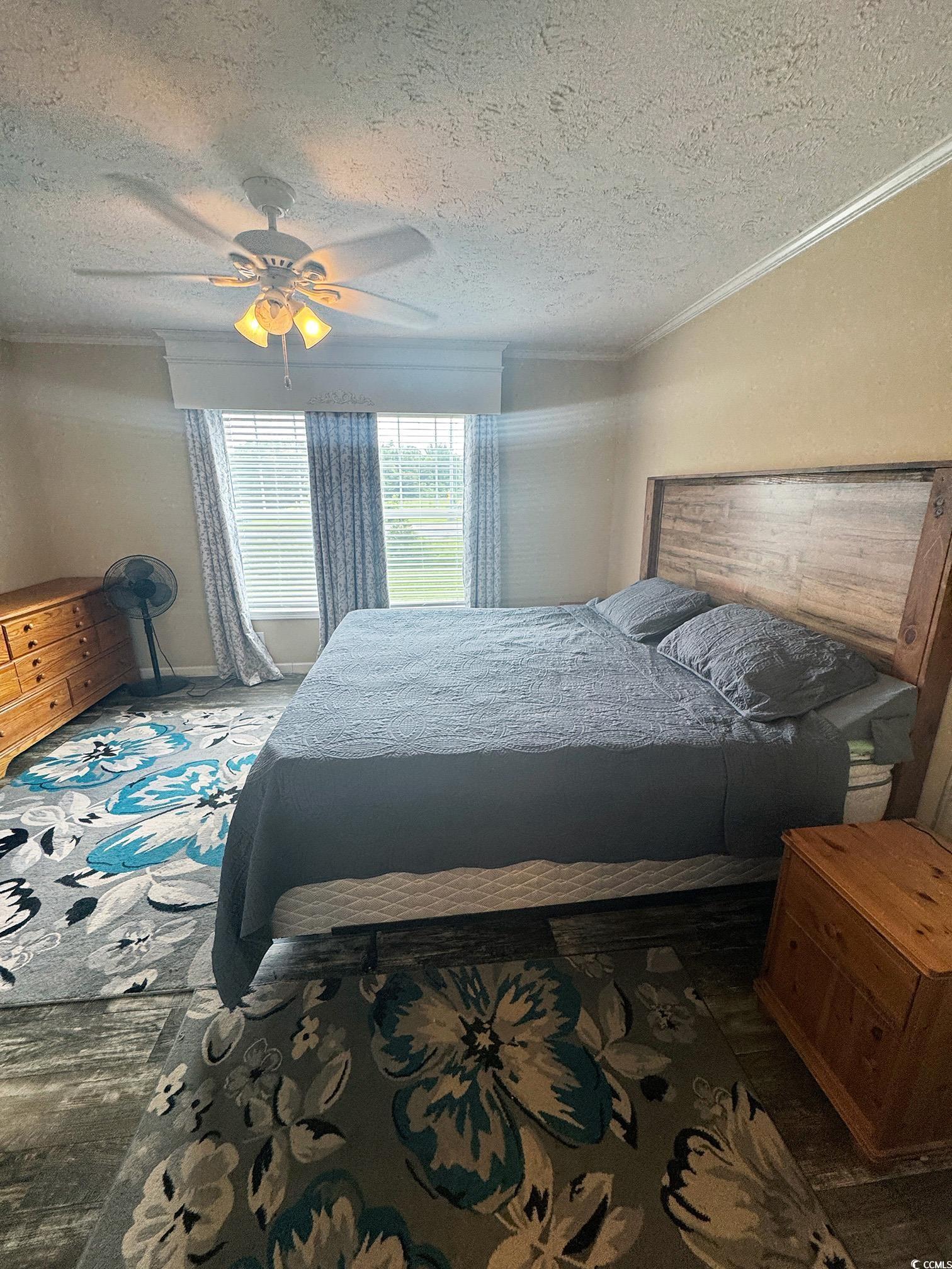 2620 Red Bluff Road Loris, SC 29569 - Photo 18 of 33 Bedroom with a textured ceiling, ceiling fan, and