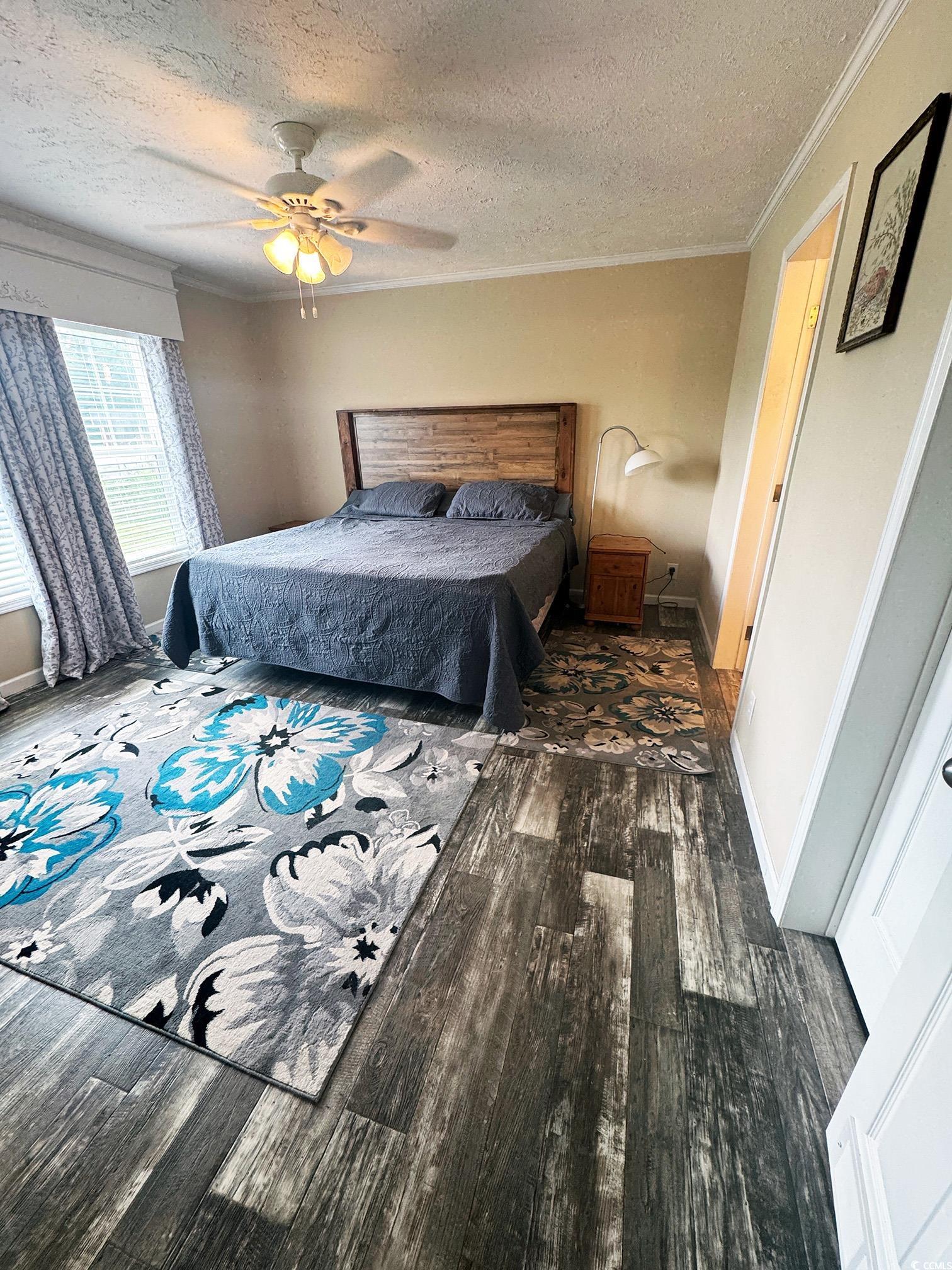 2620 Red Bluff Road Loris, SC 29569 - Photo 20 of 33 Bedroom with a textured ceiling, wood finished flo