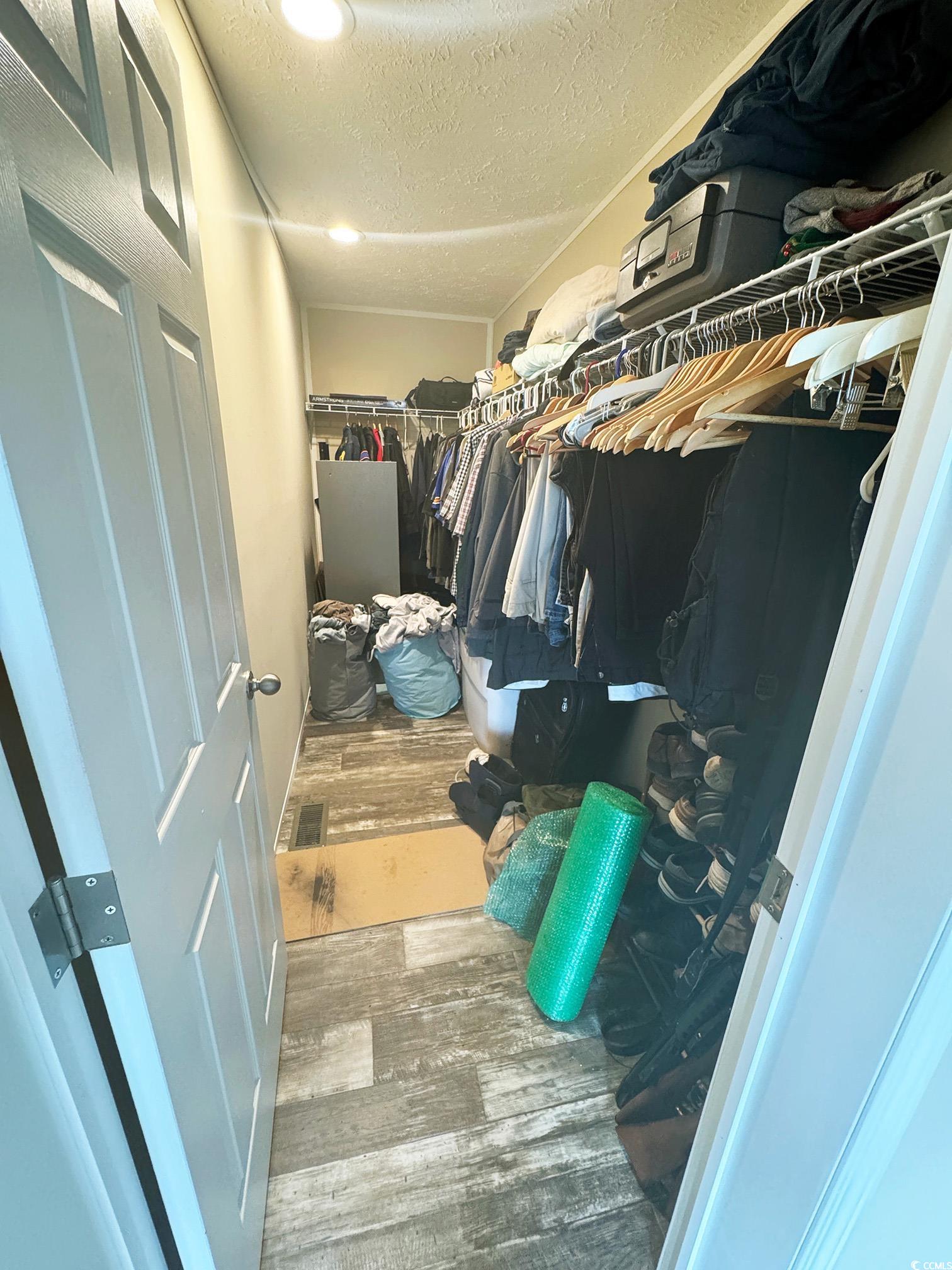 2620 Red Bluff Road Loris, SC 29569 - Photo 21 of 33 Walk in closet featuring wood finished floors