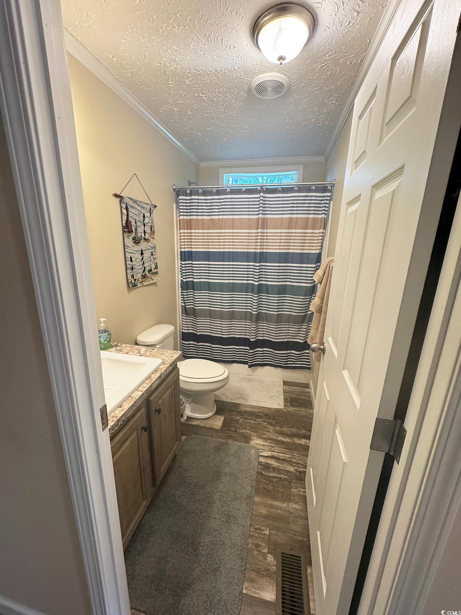 2620 Red Bluff Road Loris, SC 29569 - Photo 28 of 33 Full bath featuring a textured ceiling, wood finis