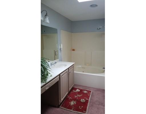 374 Grand Valley Road Springfield, MA 01128 - Photo 21 of 28 a bathroom with a granite countertop sink a toilet and bathtub