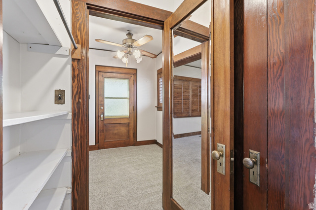 202 Main Street Smithfield, UT 84335 - Photo 21 of 32 Hallway featuring light carpet and baseboards