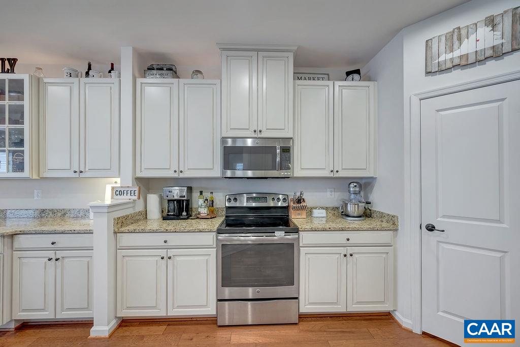 2346 Jersey Pine Ridge Charlottesville, VA 22911 - Photo 12 of 45 a kitchen with white cabinets and appliances