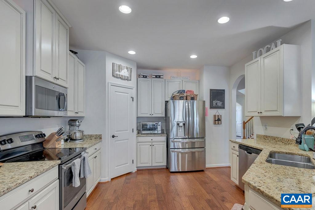 2346 Jersey Pine Ridge Charlottesville, VA 22911 - Photo 14 of 45 a kitchen with granite countertop a refrigerator stove and sink