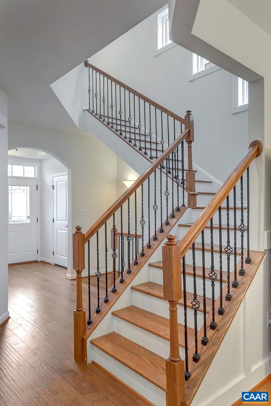 2346 Jersey Pine Ridge Charlottesville, VA 22911 - Photo 21 of 45 a view of staircase with wooden floor and white walls